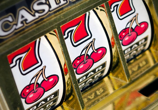 Mobile phone showing Playtech slot game with data usage indicator
